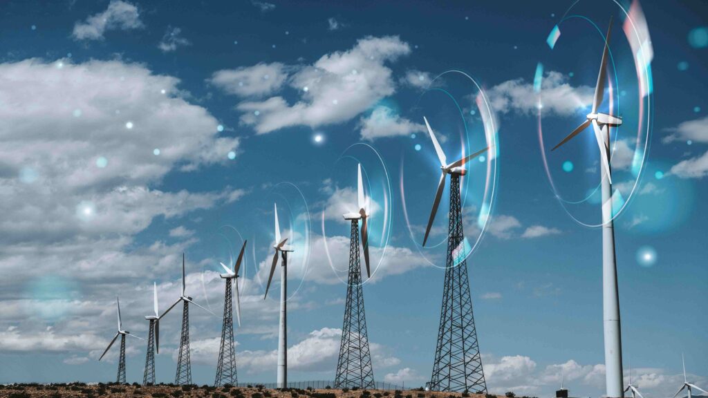  Modern wind turbines generating electricity from strong winds.